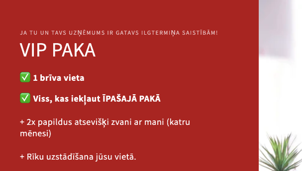 Laptop on a desk with a red promotional banner on the left side.